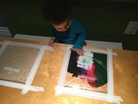 a person painting on a table