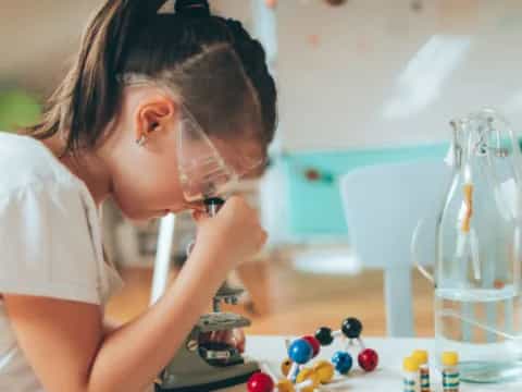 a person using a microscope