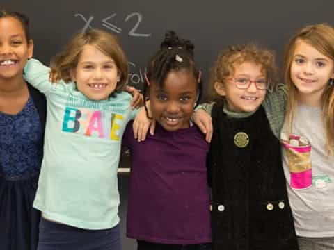 a group of children posing for a photo