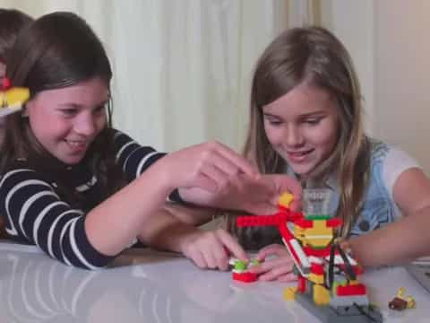 a group of girls playing with toys