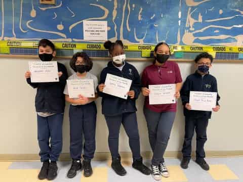 a group of people holding signs