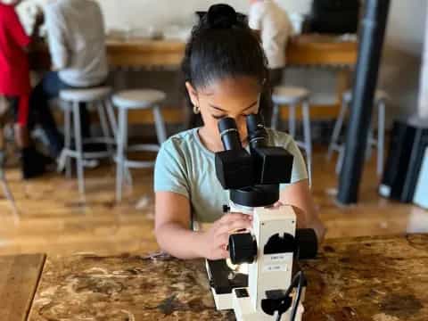 a boy using a camera