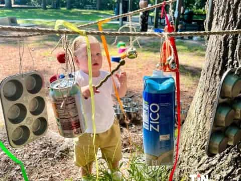 a boy holding a bucket of candy