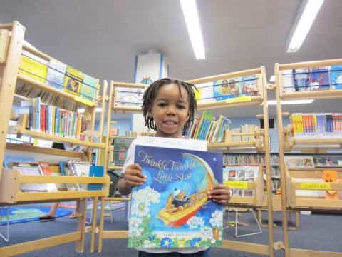 a child holding a book