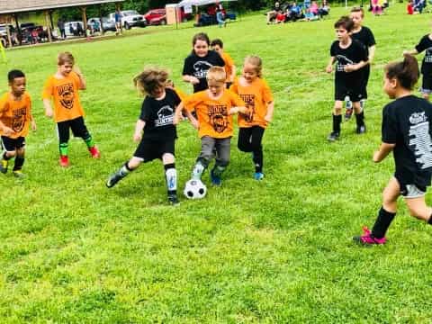 kids playing football on a field