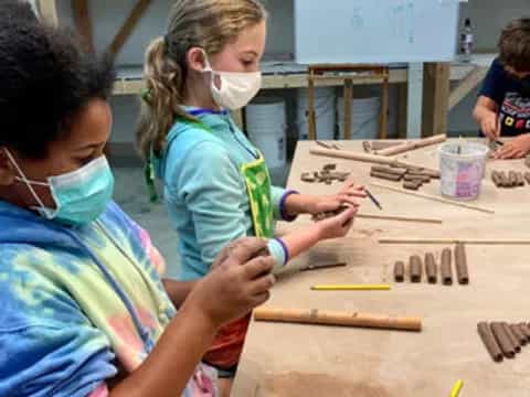 children painting on a table