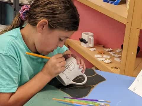 a young girl playing with a toy