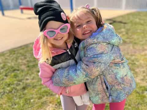 a couple girls hugging