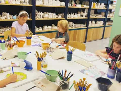 a group of children painting