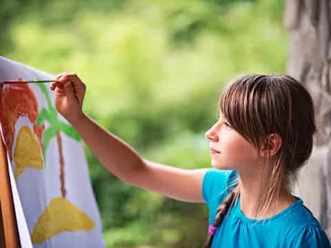 a young girl painting