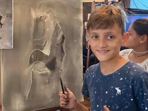 a young boy painting