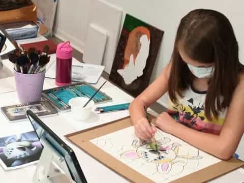 a girl sitting at a desk