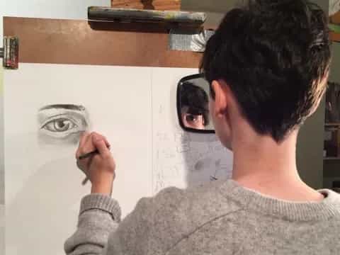 a man painting a picture