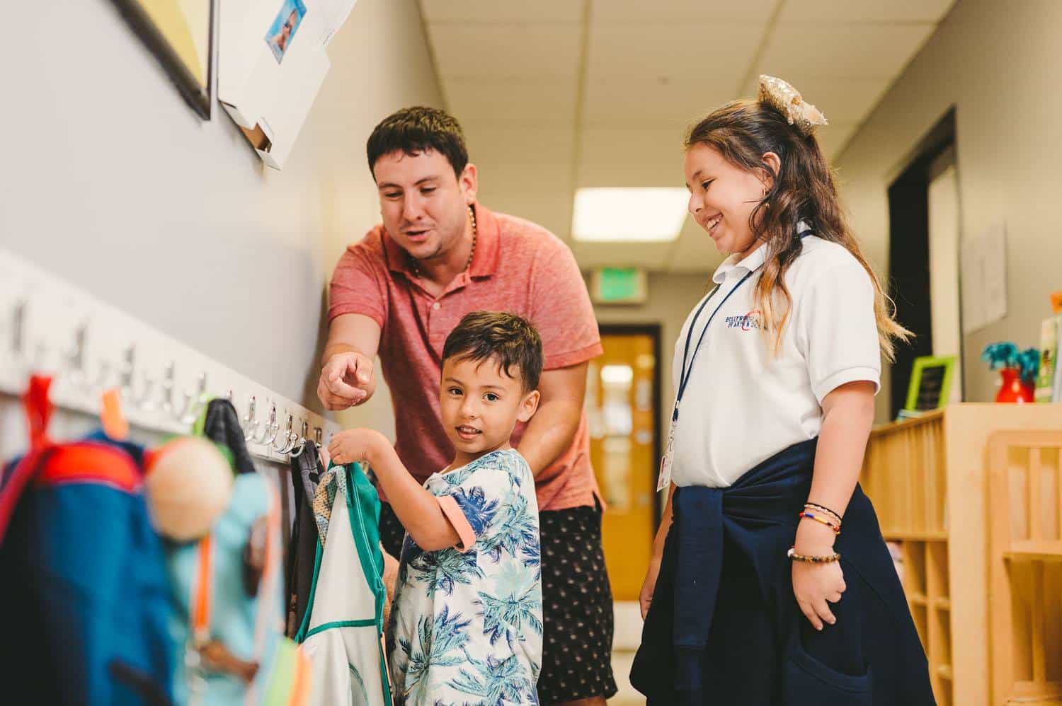 a man and woman holding a child