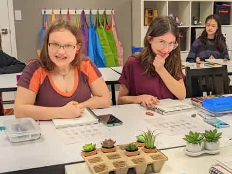 a few women sitting at a table