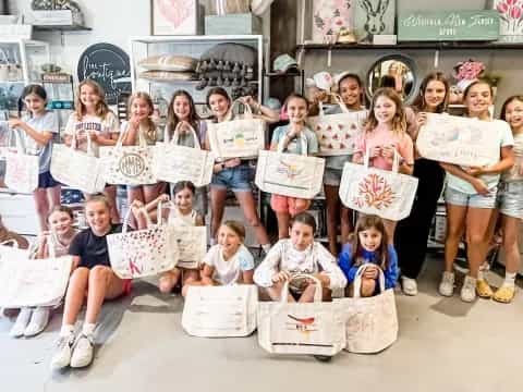 a group of children holding signs