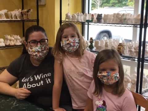 a person and two girls with paint on their faces