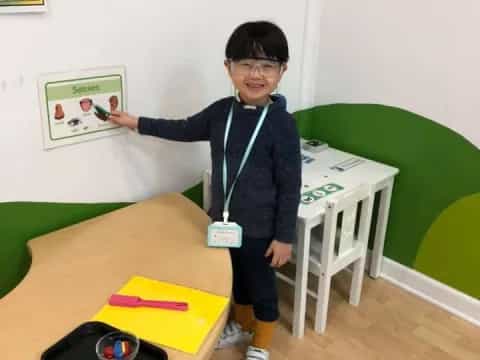 a boy standing in a room