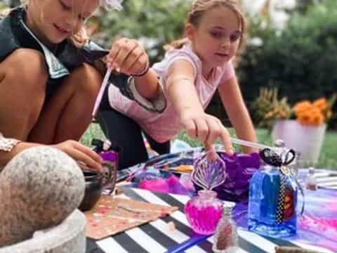 a person and a child painting