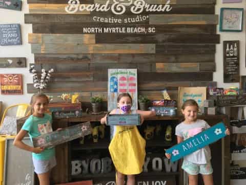 a group of children holding books