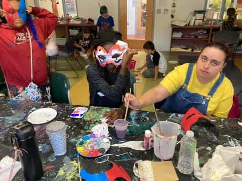 a group of people painting