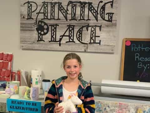 a person holding a stuffed animal