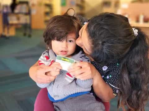 a person holding a baby