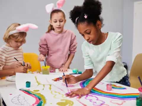 a person and children painting