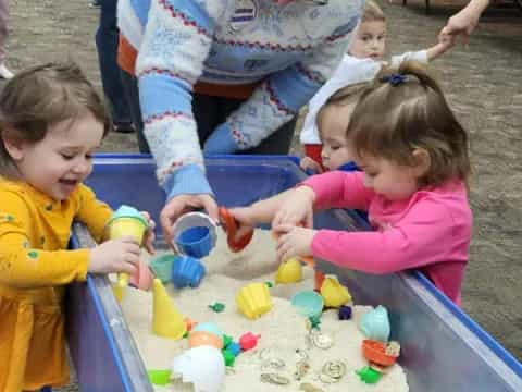 a group of children playing with toys