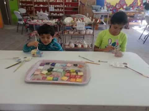 a couple of boys painting