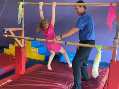 a man and a woman on a trampoline