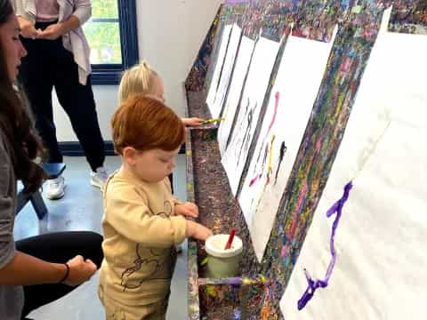 a child painting on a wall