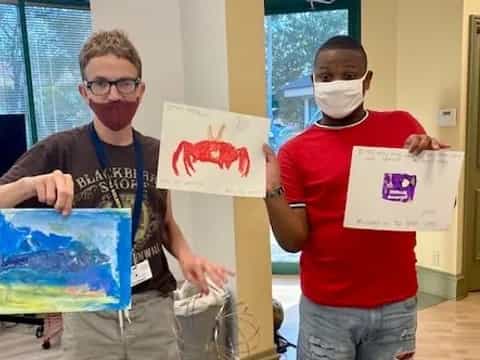 a couple of men holding signs