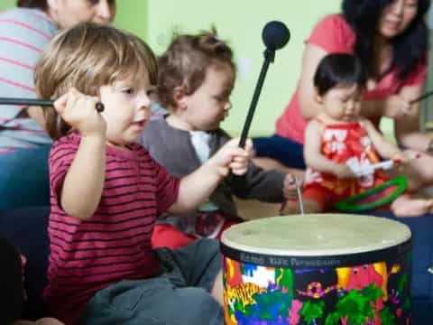 a group of kids playing drums