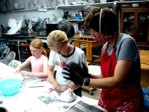 a group of people in a kitchen