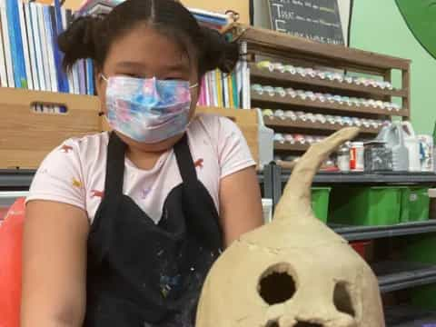 a girl with a mask on her face