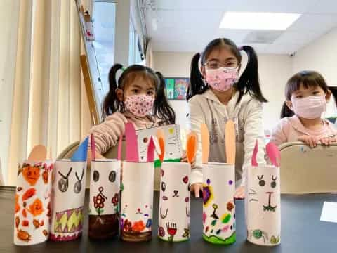 a group of girls wearing face masks