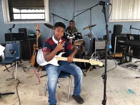 a person playing a guitar