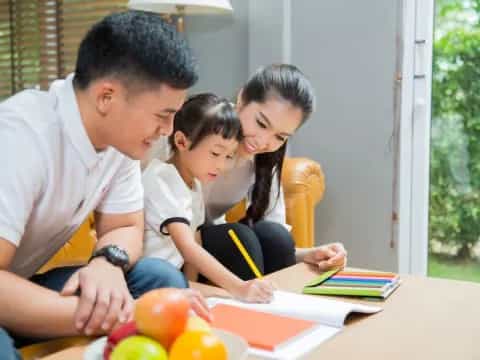 a family looking at a book