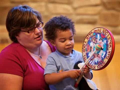 a person and a child painting
