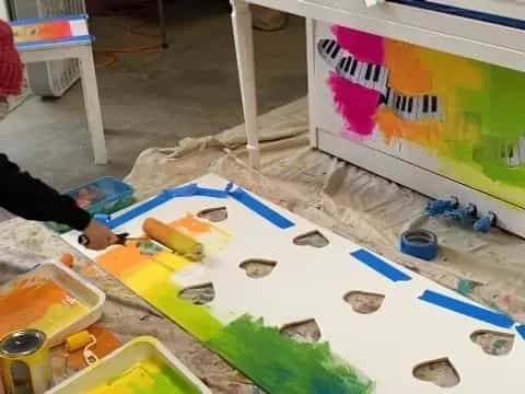 a person painting on a table