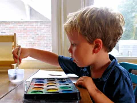 a boy sitting at a table