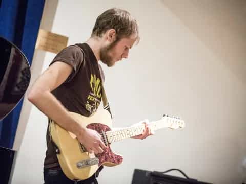 a man playing a guitar