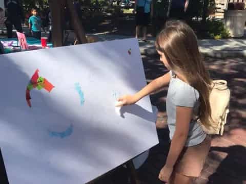 a girl painting a picture