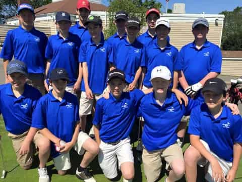 a group of people in blue shirts