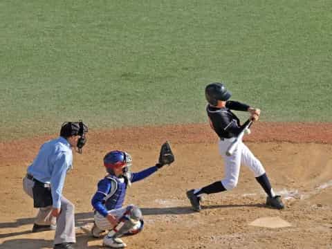 a baseball player swinging a bat