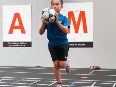 a person holding a ball