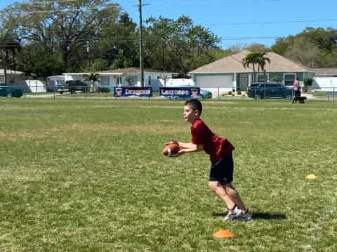 a boy holding a football