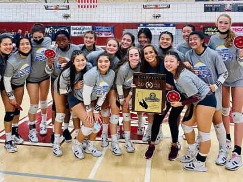 a group of women holding a sign