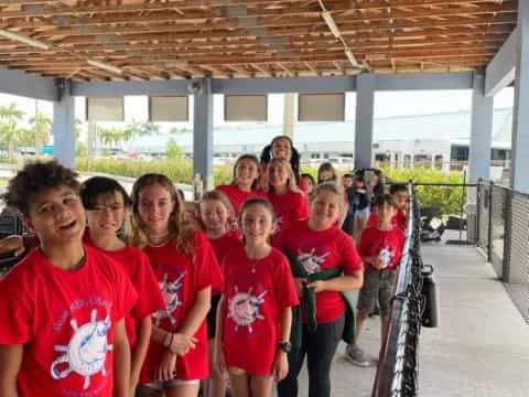 a group of people in red shirts